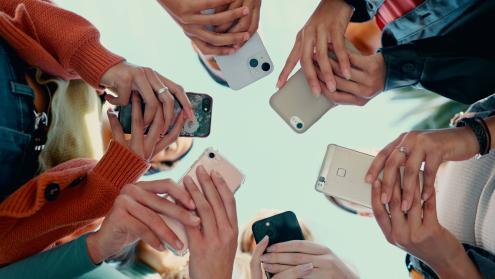people holding mobile phones