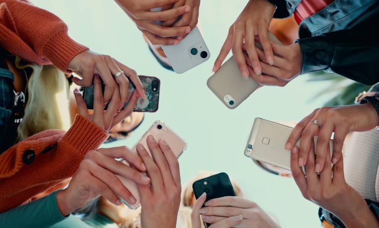 mobile phones people holding mobile phones