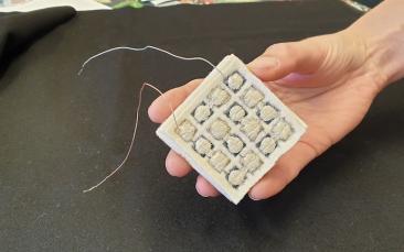 Cover image of Conductive fabric harvests body heat to drive wearable computers